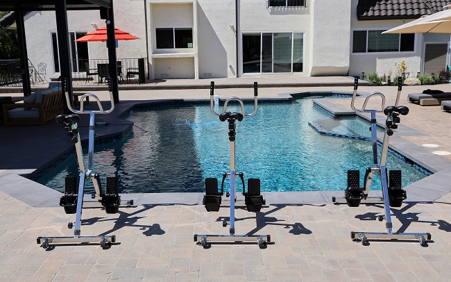 outdoor poolside gazebo and exercise bikes, highlighting wellness activities in residential treatment