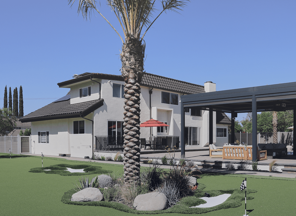 tall palm tree in a serene backyard, symbolizing peaceful and supportive residential treatment surroundings