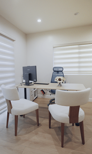Professional office space with a desk and comfortable chair, creating a welcoming work environment