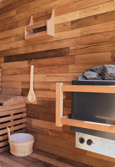 Wooden sauna wall highlighting rustic design and a warm, cozy atmosphere