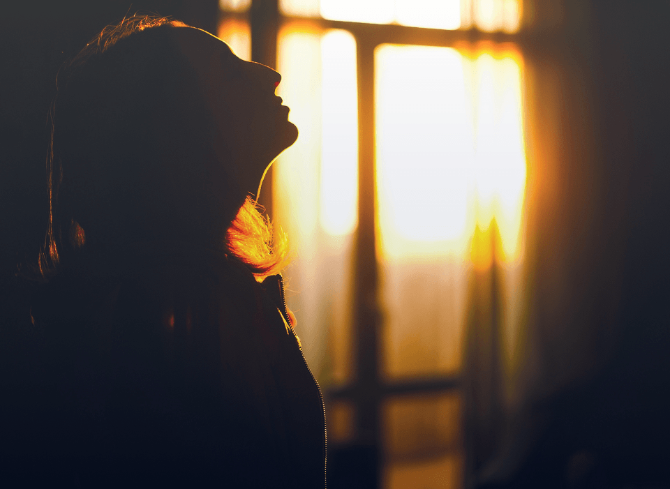 Silhouette of a woman at sunrise symbolizing hope in dual diagnosis treatment